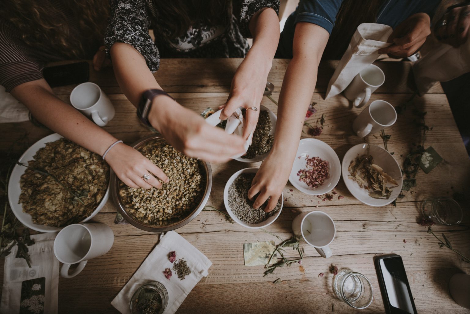 Friends sharing dishes around a table