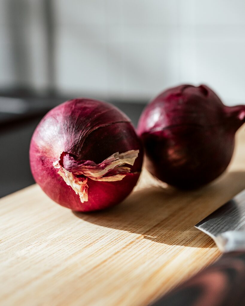 Red Onions on Cutting Board